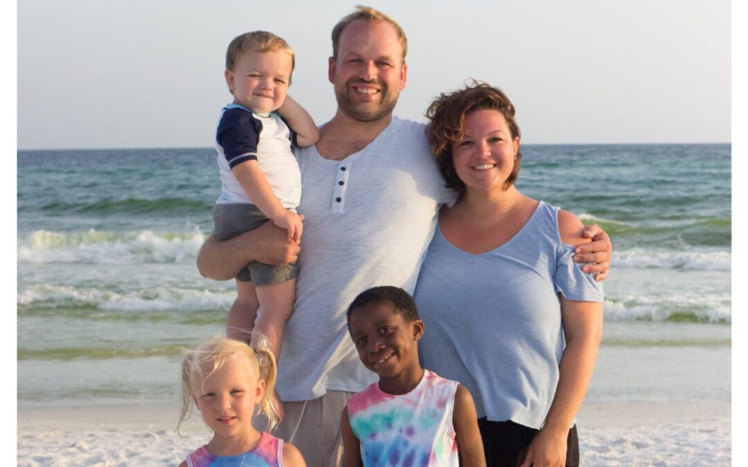 Jane Seib with her husband and three children on the beach