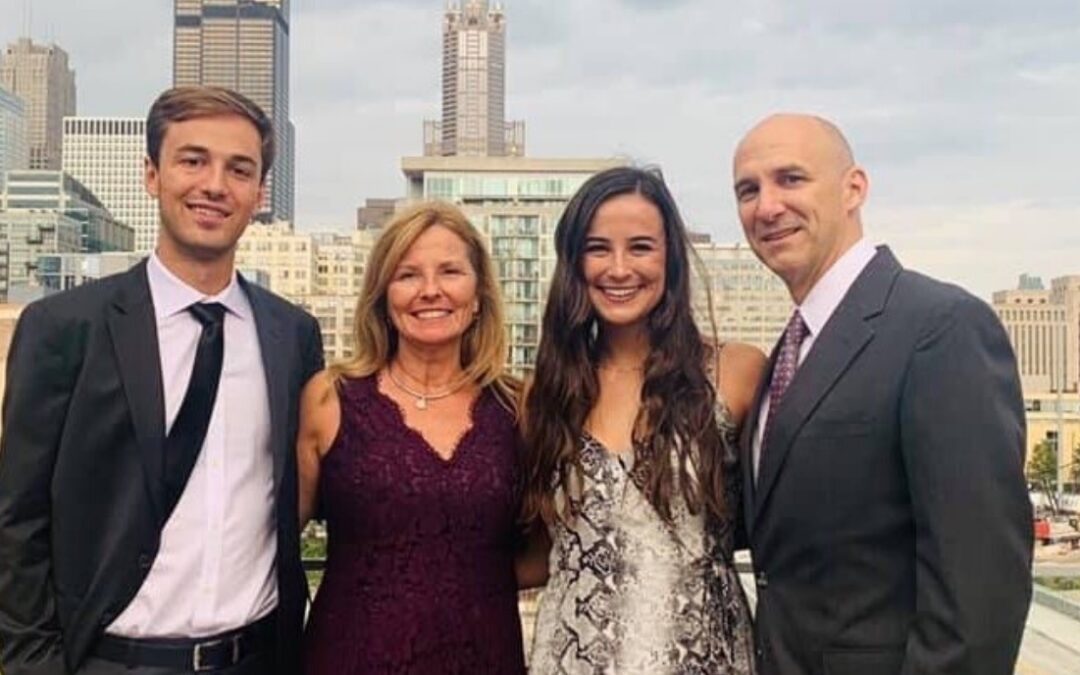 Lisa Keyes and her family posing for a picture in Downtown Indianapolis.