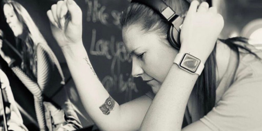 young female with headphones on