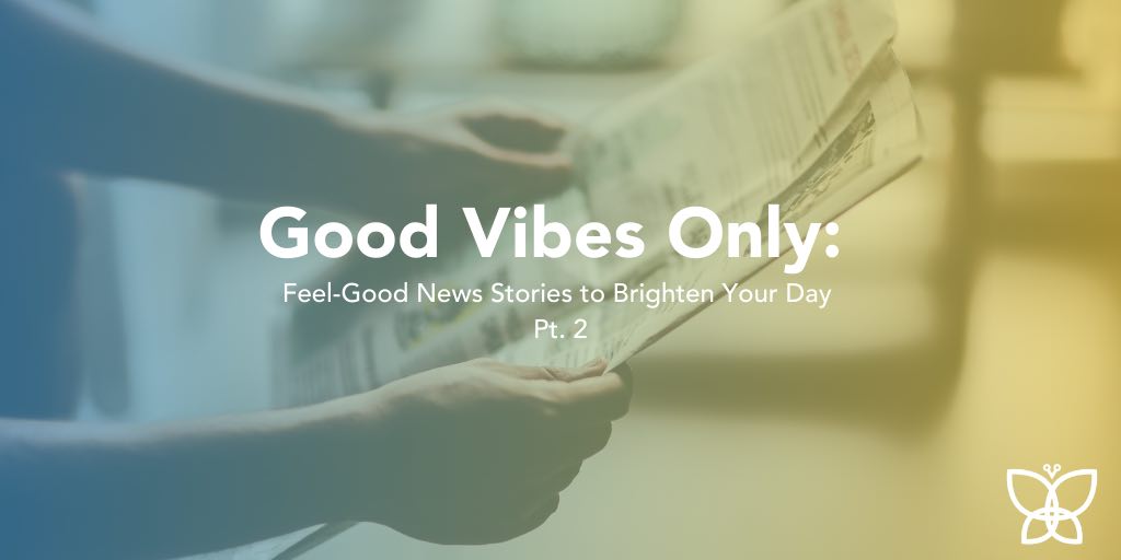 Close up of adult arms holding a news paper with text overlay that reads Good Vibes Only